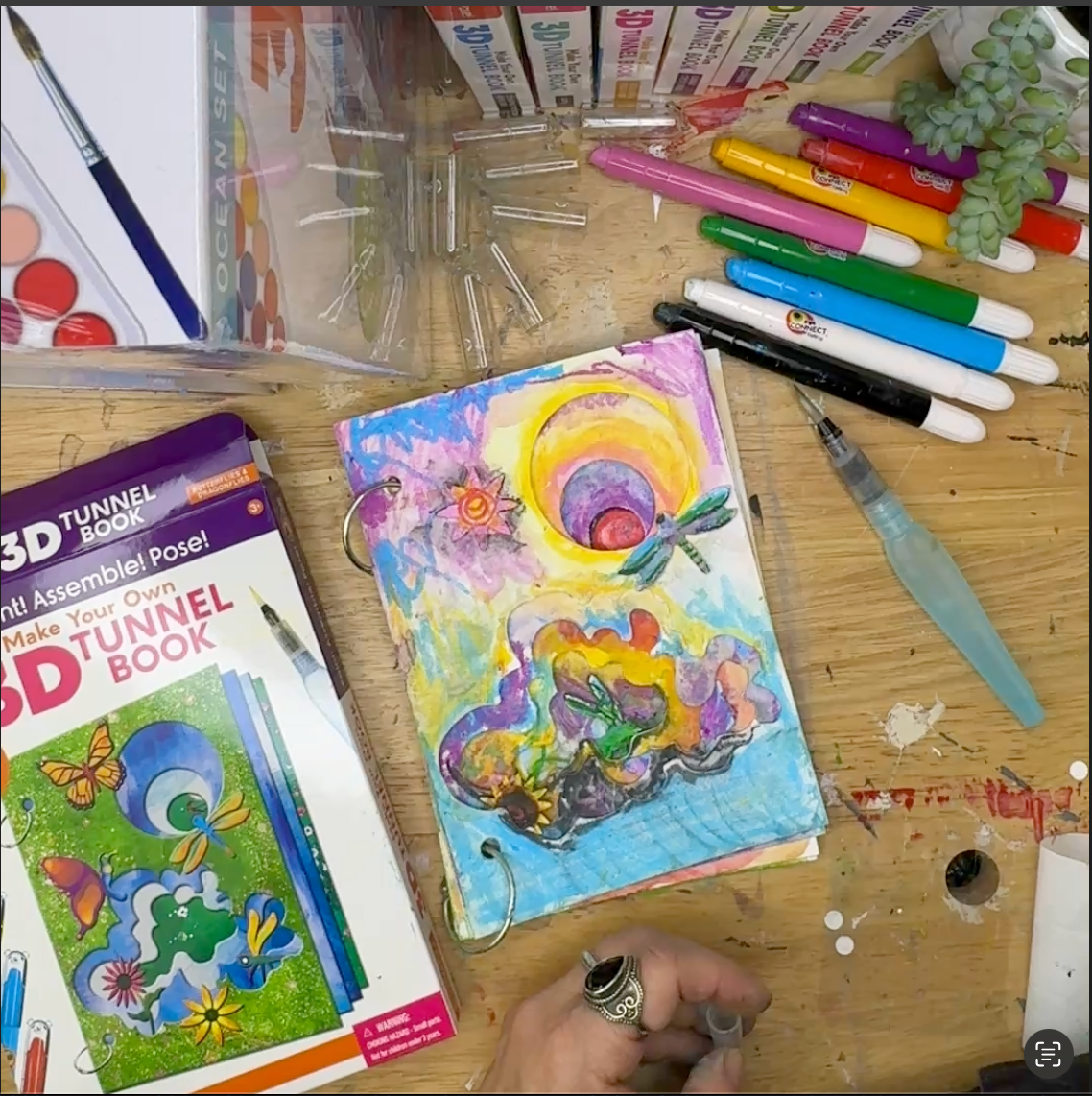An example of the butterfly and dragonflies DIY 3D Tunnel Book art and craft kits finished and colored .